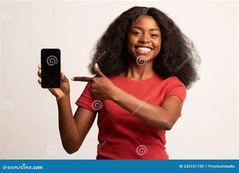 Mobile Advertisement. Smiling Black Lady Pointing on Smartphone with ...