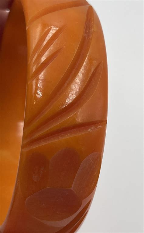 Antique Bakelite Orange Deep Carved Paw Print Bangle Gem