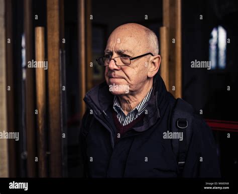 A Senior Man Is Standing In A Church Stock Photo Alamy