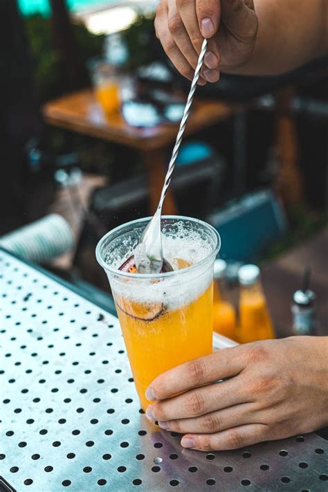 The Bartender Prepares A Cocktail With Passion Fruit Stock Image