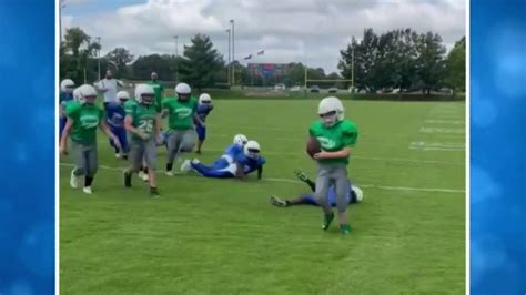 Elementary school football teams come together to set up special play ...