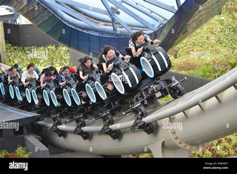 Visitors Have Fun On The Roller Coaster At Tomorrowland In The Shanghai