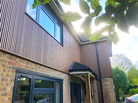 Ecoscape Spiced Oak Slatted Cladding Installation In Caterham Surrey