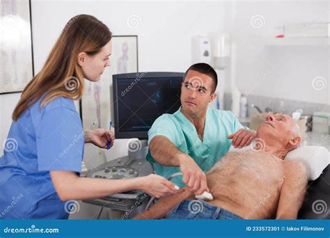 Two Sonographers Working With Patient Stock Image Image Of Diagnostic Computer 233572301