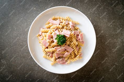 Premium Photo Spiral Pasta Mushroom Cream Sauce With Ham