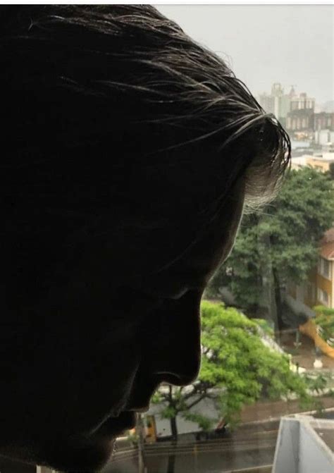 The Back Of A Person S Head As They Look Out Over A City