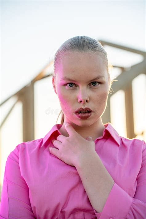 Perfect Imperfection Caucasian Curvy Model With Blonde Hair And Pink Dress In Sunlight Outdoors