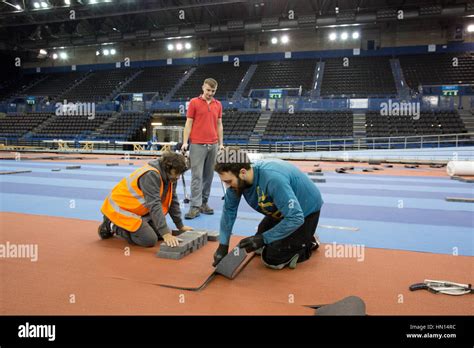 Workers Laying The New Infield Track At The National Indoor Arena In