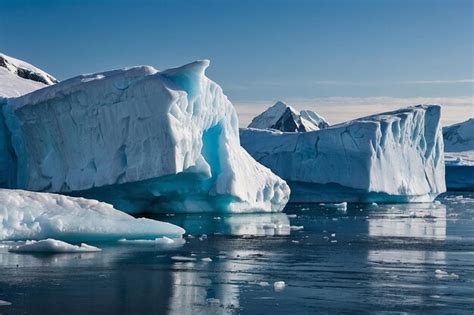 Premium Photo | Towering icebergs in a frozen arctic landscape