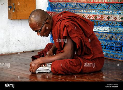 Red Robed Buddhist Monk Read Reading Pray Praying Shwedagon Pagoda