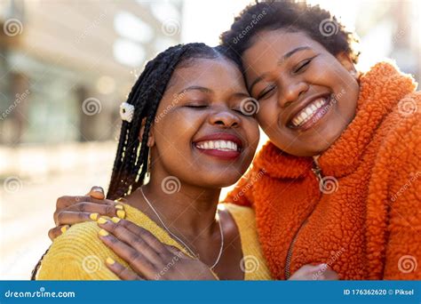 Two Beautiful Afro American Women In An Urban City Area Stock Photo