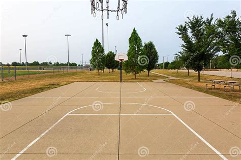 Two Open Basketball Courts on a Smoky Sky Morning Stock Image - Image ...