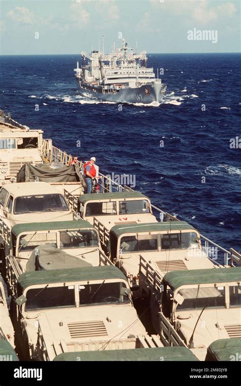 Crew Members Stand By On The Deck Of The Rapid Response Vehicle Cargo