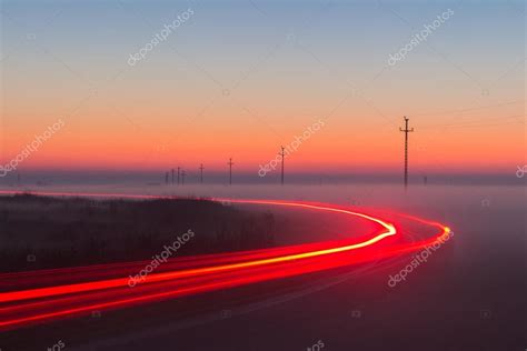 Long Exposure Red Car light trails on a road Stock Photo by ©DaLiu 95794090