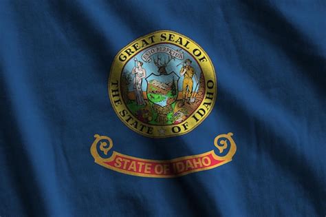 Premium Photo Idaho US State Flag With Big Folds Waving Close Up