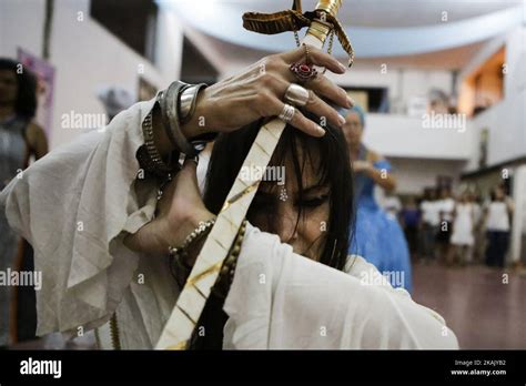 A Woman Taken By A Spirit Dances In Trance With A Metal Sword During