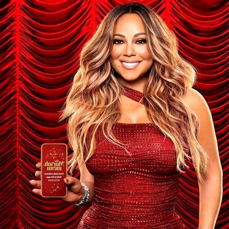 Vêtue d une énorme robe rouge à paillettes Mariah Carey se lâche pour