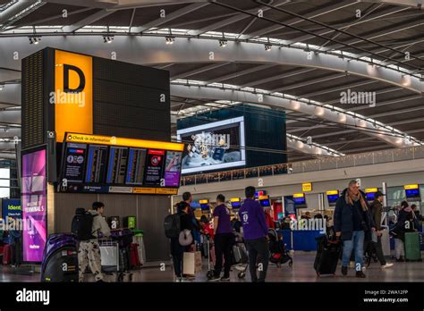 Busy Scene With People Inside The London Heathrow Airport Terminal 5