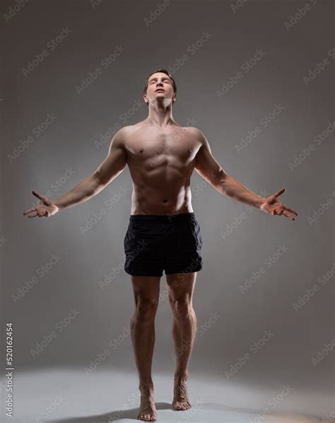 Young Muscular Man In An Expressive Pose Artistic Pose Of The Hero