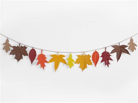 Autumn Leaves Are Hanging On A Clothes Line