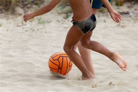 Boys playing beach soccer stock photo. Image of player - 14755294