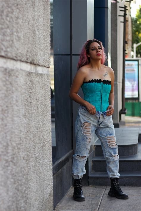 Woman Posing in Distressed Jeans Outfit and Short Pink Hair · Free ...