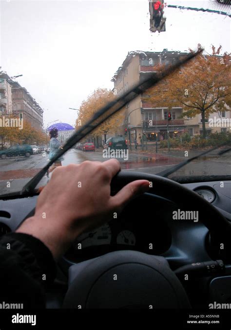 car driving rain Stock Photo - Alamy