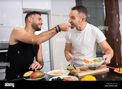 Gay Couple Cooking Healthy Vegan Food Together At Home Homosexual Relationship Concept Gay