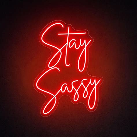 A Red Neon Sign That Says Stay Sassy