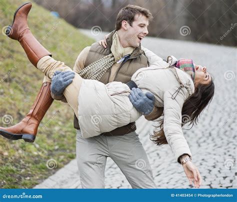 Happy Man Carrying Woman in Park Stock Photo - Image of front, 2529: ...