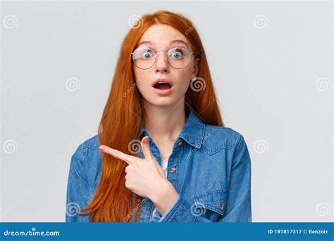 Surprised And Wondered Amused Attractive Redhead Woman In Glasses Red