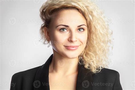 blonde woman with curly hair in studio 16497941 Stock Photo at Vecteezy