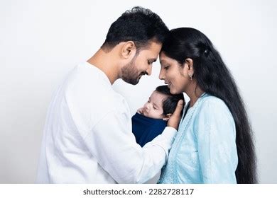 portrait indian parents newborn baby young stock photo