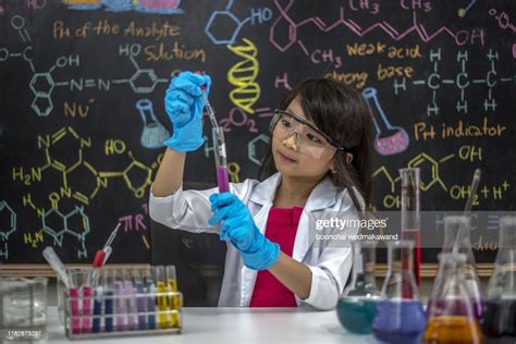 Girl Cute School Pupil Play With Test Tubes And Colorful Liquids School