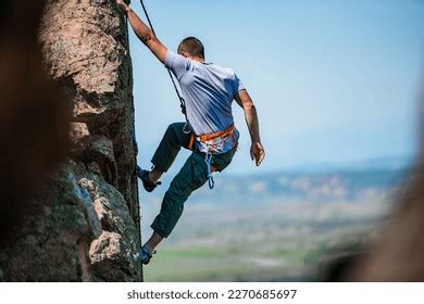 Rockclimber Finding Foothold On Steep Mountain Stock Photo 2270685697 ...