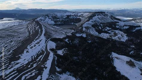 Aerial Drone Scene Of Snowy Batea Mahuida Volcano In Villa Pehuenia