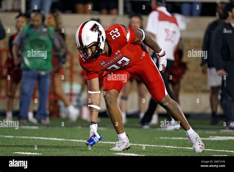 Texas Tech S Reggie Pearson Jr 22 Grabs A Beer Can That Was Thrown Onto The Field During The