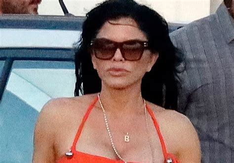 Lauren Sanchez Poses In Tiny Orange Bikini And Shorts While Hand In