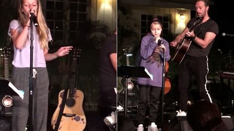 Coldplay's Chris Martin performs with his two KIDS at charity...