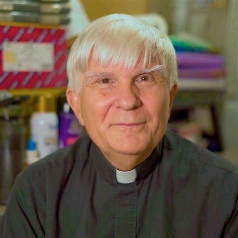 An Older Man With White Hair Wearing A Priest S Outfit