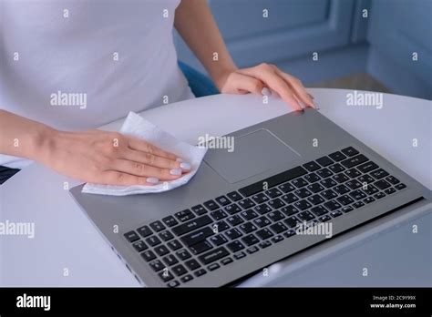 Woman Hands Cleaning Laptop Keyboard With Antiseptic Disinfectant Wet