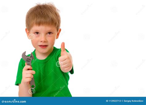 A Small Boy Holds A Wrench In His Hand Stock Image Image Of