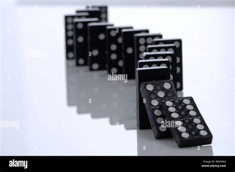 Falling Row Of Dominoes Stock Photo Alamy