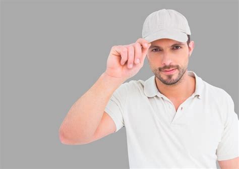 Premium Photo Portrait Of Man Wearing Cap With Grey Background