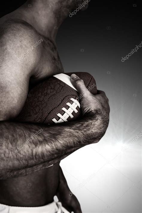 Shirtless Rugby Player Holding Ball Stock Photo By Wavebreakmedia 88040758