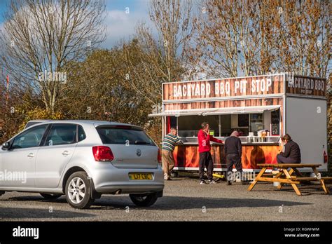 Customers Waiting For Their Food Orders At The Backyard Bbq Pit Stop