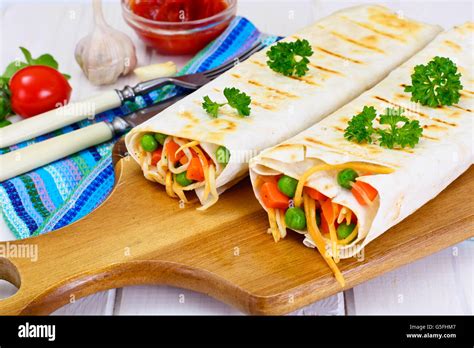 Pita Bread With Vegetables Chinese Noodles And Arugula Stock Photo Alamy