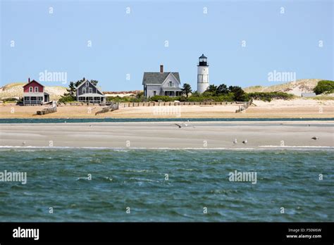 Sandy Neck Beach's old cottage colony and Sandy Neck Lighthouse seen ...