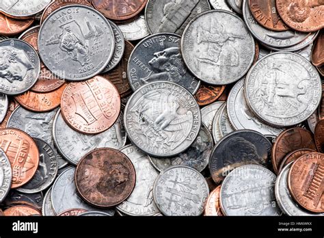 A Pile Of American Currency Coins Including Quarters Dimes Nickels