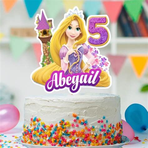 There Is A Birthday Cake With A Princess Figure On It And Confetti